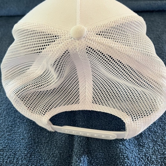 Hat adjustable sizing. White with gold lettering. Butterfly Strong. Mesh back. - Picture 6 of 7